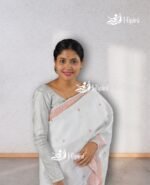 model wearing white coloure handmade (handloom) nuni cotton mekhela sador