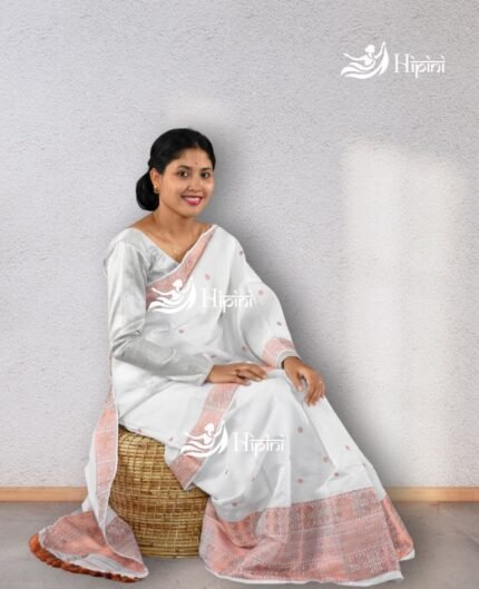 model wearing white coloure handmade (handloom) nuni cotton mekhela sador