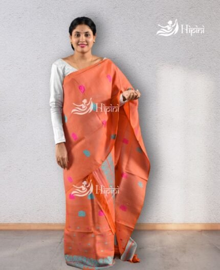 Model wearing orange coloure handmade(handloom) nuni cotton mekhela sador